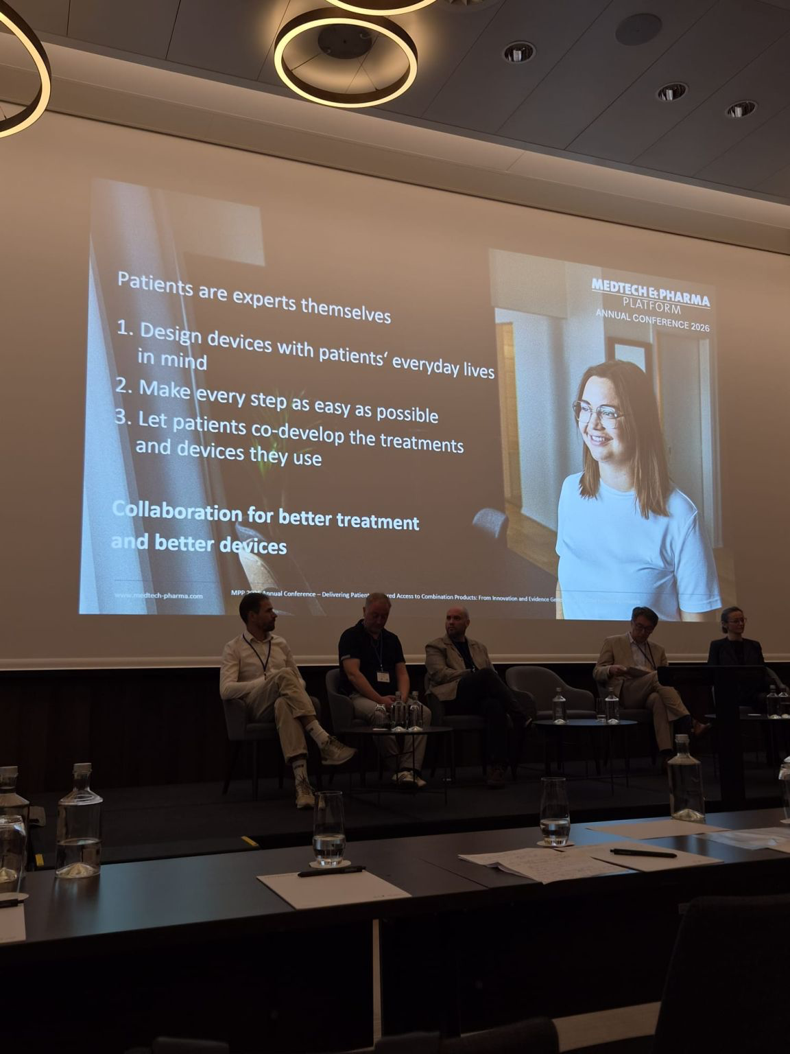 A conference slide states “Patients are experts themselves” and highlights designing treatments and devices around everyday life.