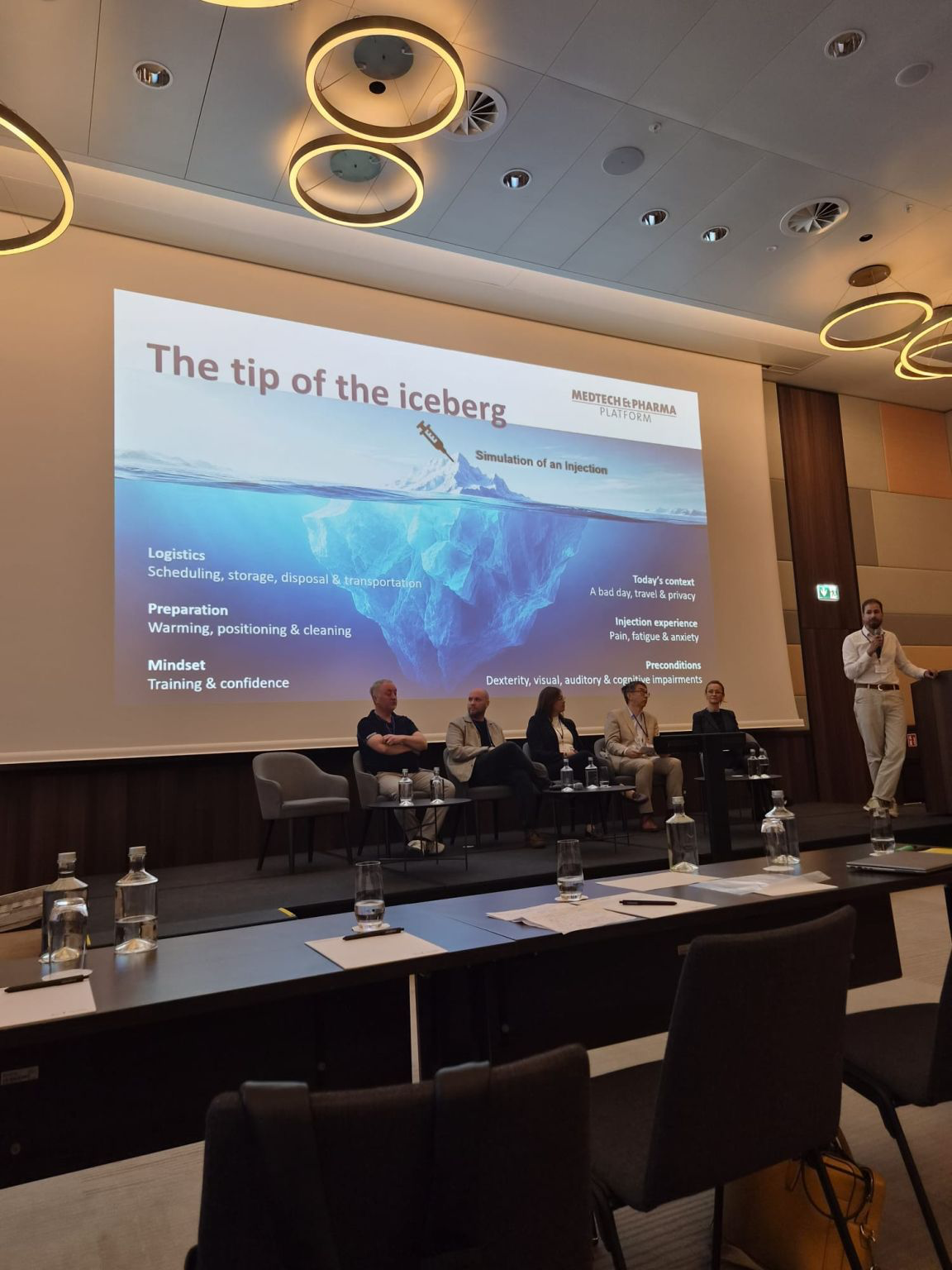 A presentation uses “The tip of the iceberg” to explore the less visible human factors surrounding an injection.